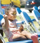  ?? ?? Aliyah Settles, 19 months. has some ice cream during the Juneteenth Freedom Festival at Gary City Hall on Saturday.