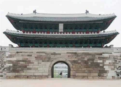  ?? Ahn Young- joon/ The Associat ed Press ?? Five years after being torched by an arsonist, South Korea’s most revered historic site, Sungnyemun gate in Seoul, is set to reopen.