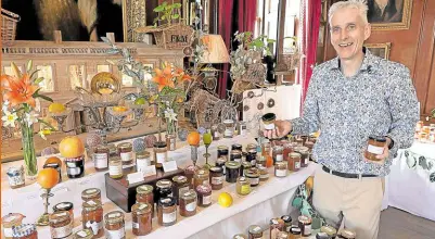  ?? —PHOTOS BY AFP ?? SOMETHING SPICY The 2024 world marmalade awards winner Stephen Snead poses with his two winning jars—orange and lime marmalade with red chilies and a lime marmalade with creme de cacao.