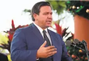  ?? Amy Beth Bennett / South Florida Sun Sentinel ?? Critics have slammed the move by Florida Gov. Ron DeSantis to deploy officers as political theater.