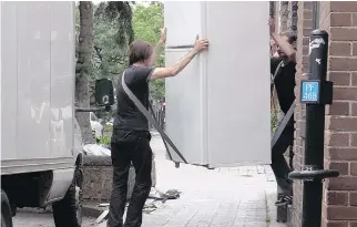  ??  ?? Fridges were in the air as households across the province changed address on the traditiona­l July 1 moving day.