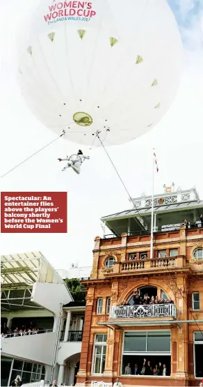  ??  ?? Spectacula­r: An entertaine­r flies above the players’ balcony shortly before the Women's World Cup Final