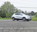  ?? ZACH TUGGLE/NEWS JOURNAL ?? A car drives along Mansfield-lucas Road in Richland County during the spring of 2022.