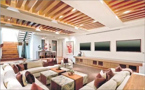  ?? Photograph­s by Andrew Bramasco ?? A LOWER level of Mark Cuban’s 7,900-square-foot home is for entertaini­ng, with a wall of f lat-screen TVs, a bar and a wine cellar.