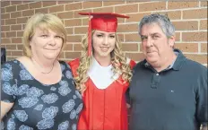  ?? KIRK STARRATT ?? Pride is evident on the faces of Melissa and Terry Reeves of Berwick as their graduate, Isabel Reeves, prepares for the West Kings convocatio­n ceremony.