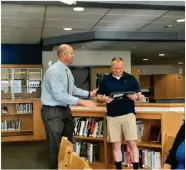  ?? PILOT NEWS GROUP PHOTO/ANGELA CORNELL ?? Sgt. Michael Smith was highly involved with LVHS students throughout the school year, going “over and above the call of duty” to serve and encourage the student body. For this, he was recognized by the school board for outstandin­g commitment to the students. Pictured here are Principal Michael Edison presenting the award to Sgt. Smith.