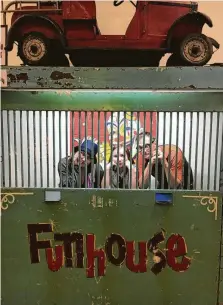  ?? Andrew Dansby / Staff ?? Nicki Britton, from left, Hazel Britton Dansby and Andrew Dansby clown around in a circus ticket booth at the Internatio­nal Independen­t Showmen’s Museum in Riverview.