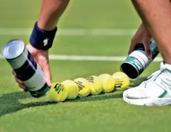  ?? GETTY IMAGES ?? The primary responsibi­lity of ball boys and girls is to efficientl­y remove balls from the playing area and then quickly return to their stationary positions.