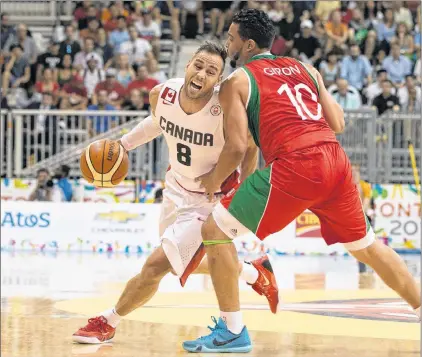  ?? CHRIS YOUNG /CANADIAN PRESS FILE PHOTO ?? In this July 23, 2015, file photo Canadian guard Carl English (left) is fouled by Mexico’s Gabriel Giron during their men’s basketball preliminar­y-round game at the 2015 Pan Am Games in Toronto. English, from Patrick’s Cove, Placentia Bay, has been...