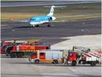  ?? ?? Firefighte­rs and emergency crews await a call for help at Düsseldorf airport