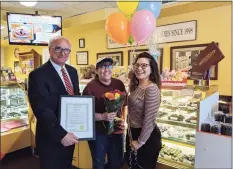  ?? Kim Bova / Contribute­d photo ?? In 2019, Deborah Ann Backus, center, received the Woman of the Year award in Ridgefield. First Selectman Rudy Marconi, left, and Chamber Executive Director Kim Bova presented her with the award.