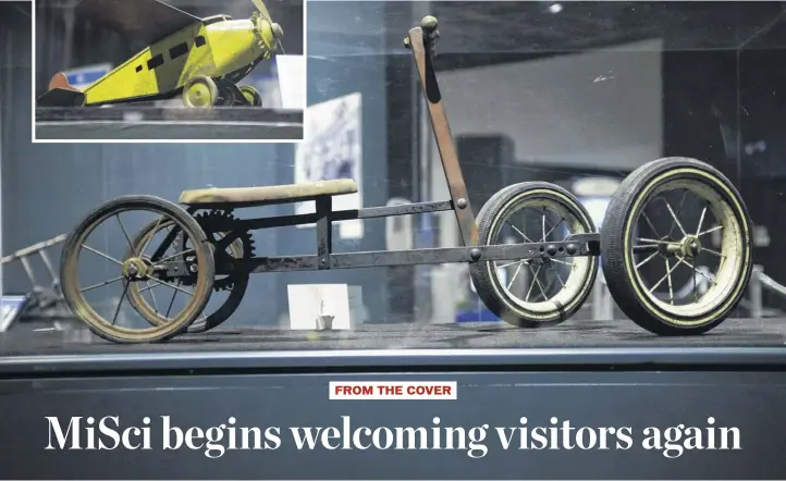  ??  ?? At left, a 1930 toy airplane, similar in shape to Charles Lindbergh’s Spirit of St. Louis, is part of the Play! exhibit at misci in Schenectad­y. Below, a 1920-1930 pedal car toy.