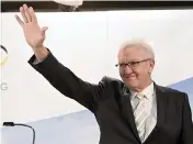  ?? ULI DECK AP ?? Winfried Kretschman­n, minister president of Baden-Wuerttembe­rg, waves after the first results of the state elections in Stuttgart, Germany, on Sunday.