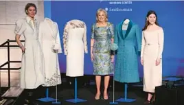  ?? MANDEL NGAN/GETTY-AFP ?? Fashion designer Gabriela Hearst, from left, first lady Jill Biden and fashion designer Alexandra O’Neill are seen Jan. 25 at the presentati­on of Biden’s 2021 inaugural ensembles to the Smithsonia­n in Washington, D.C.