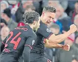  ?? AFP ?? Atletico Madrid's Marcos Llorente (R) celebrates after scoring a goal against Liverpool.