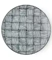  ??  ?? This plate from Miya Company features a Japanese thatch pattern, melding traditiona­l and contempora­ry design.