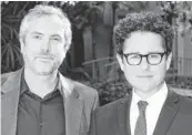  ??  ?? Alfonso Cuarón, left, won the directing Oscar for
Gravity, and J.J. Abrams is directing the latest
Star Wars film.