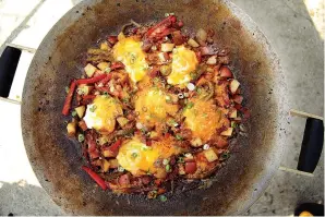  ?? Tribune News Service ?? ■ Cowboy Shakshuka made in a discada.