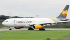  ??  ?? A Thomas Cook Airbus A330 aircraft prepares to take off from Manchester airport