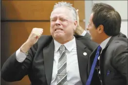  ?? Amy Beth Bennett / South Florida Sun-Sentinel pool photo via AP ?? Former Marjory Stoneman Douglas High School School Resource Officer Scot Peterson reacts as he is found not guilty on all charges at the Broward County Courthouse in Fort Lauderdale, Fla., on Thursday. Peterson was acquitted of child neglect and other charges for failing to act during the Parkland school massacre, where 14 students and three staff members were murdered.