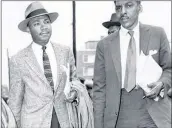  ?? AP ?? A new statue of Martin Luther King Jr. planned for the Georgia Capitol is based on this photo of King with Bayard Rustin and Ralph David Abernathy (not seen here) during the Montgomery Bus Boycott on Feb. 24, 1956.