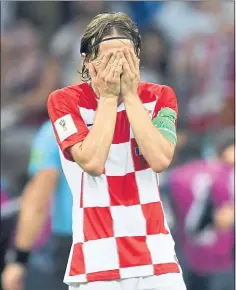  ?? KIRILL KUDRYAVTSE­V — AFP/GETTY IMAGES ?? Croatian midfielder Luka Modric reacts after his team conceded a goal during its 4-2 loss to France in the World Cup final in Moscow on Sunday.