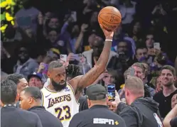  ?? MARK J. TERRILL/THE ASSOCIATED PRESS ?? Lakers forward LeBron James celebrates becoming the first NBA player to reach 40,000 points in a career Saturday in Los Angeles.