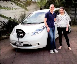  ??  ?? Sean and Imogen Thompson plug in their 2011 Nissan Leaf Electric Car each night, just like they would their phone.