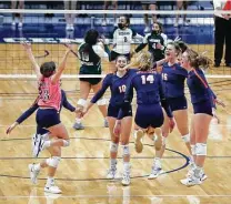  ?? Karen Warren / Staff photograph­er ?? Seven Lakes celebrates a point against Reagan during Monday’s Class 6A state semifinal match at the Merrell Center in Katy.