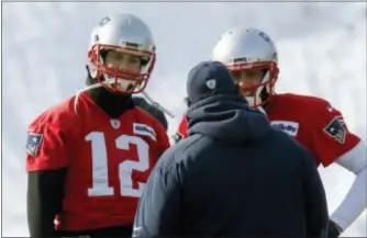  ?? BILL SIKES — THE ASSOCIATED PRESS ?? Defensive coordinato­r Matt Patricia, center, talks to quarterbac­ks Tom Brady (12) and Brian Hoyer (2) as the Patriots warm up during practice on Friday in Foxborough, Mass.
