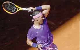  ?? (AFP) ?? Rafael Nadal returns the ball to Carlos Alcaraz during their Madrid Open match in Madrid on Wednesday