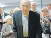  ?? DESIREE ANSTEY/ JOURNAL PIONEER ?? Reverend Joseph Brazel prepares to cut into his retirement anniversar­y cake, and closes the chapter on his service with a few laughs, tears, and wise advice at St. Paul’s Church in Summerside.