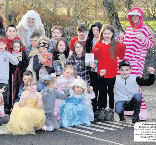  ??  ?? Celebratio­n Pupils and staff at Kettins Primary School dressed as their favourite characters to mark Book Week Scotland