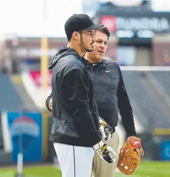  ?? Joe Amon, The Denver Post ?? Dugger has built the kind of rapport with players, such as star third baseman Nolan Arenado, left, that they are even willing to hear his criticism.