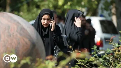  ?? ?? By law, women in Iran must wear a hijab while in public spaces