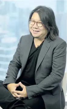  ?? VINCENTYU/ THE ASSOCIATED PRESS ?? Singaporea­n novelist Kevin Kwan talks during an interview in Hong Kong.