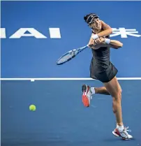  ?? AFP ?? Garbine Muguruza hits a return against Anastasija Sevastova in their women’s singles second round match. —