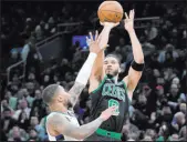  ?? Steven Senne The Associated Press ?? Celtics forward Jayson Tatum lines up a shot over Bucks guard Damian Lillard in Boston’s 122-119 victory Wednesday.