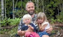  ??  ?? New Karamea resident Nathan Young with Tessa, 1, left, and Zoe, 4.