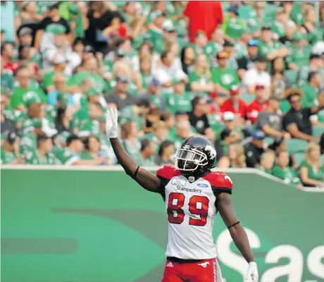  ?? PHOTOS: MARK TAYLOR/THE CANADIAN PRESS ?? Calgary’s DaVaris Daniels waves to Riders fans after scoring a touchdown during Saturday’s game.