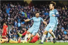  ??  ?? Manchester City’s Argentinia­n striker Sergio Aguero (C) celebrates after scoring during the English Premier League football match between Manchester City and Liverpool at the Etihad Stadium in Manchester, north west England. - AFP photo