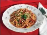  ??  ?? Local strawberri­es and San Marzano tomatoes star in this surprising spaghetti dish.