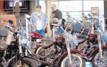  ?? Scott Olson Getty Images ?? HARLEY-DAVIDSON, citing retaliator­y EU tariffs in response to levies by President Trump, is shifting production of bikes for European riders to unspecifie­d overseas plants. Above, a dealership in Wisconsin.