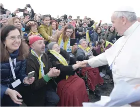  ?? — Reuters ?? Pope Francis meets the faithful in the Forlanini district of Milan, Italy, on Saturday.