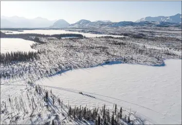  ?? LOREN HOLMES — THE ASSOCIATED PRESS ?? Linwood Fiedler mushes across Submarine Lake near Nikolai, Alaska on March 10during the Iditarod.