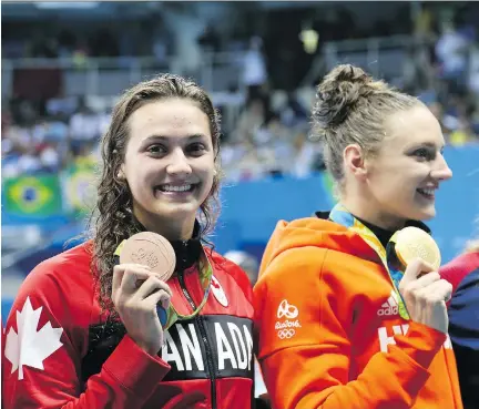  ?? JEAN LEVAC/FILES ?? Hungarian swimmer Katinka Hosszu, right, seen on the podium with Canadian Kylie Masse at the Rio Olympics, is spearheadi­ng an effort to form a profession­al swimmers’ union to garner strength in their dealings with the sport’s troubled internatio­nal...