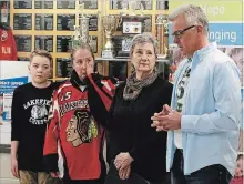  ?? CLIFFORD SKARSTEDT EXAMINER ?? From left, hockey player Trent Staude, Sheri Erickson, Brent’s mother , CMHA community engagement manager Kerri Davies and Team55’s Dave Pogu promote the Brent Upper Memorial Ball tourney in Norwood.