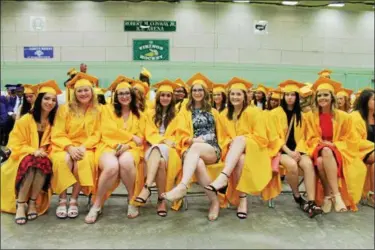  ?? PHOTOS BY LAUREN HALLIGAN — LHALLIGAN@DIGITALFIR­STMEDIA.COM ?? A group of girls gathered before the start of Troy High School’s 2017 commenceme­nt ceremony on Sunday at Hudson Valley Community College in Troy.