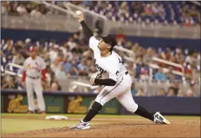  ?? AP photo ?? The Marlins’ Jordan Yamamoto delivers a pitch during the fifth inning of Miami’s 9-0 win over St. Louis on Wednesday. Yamamoto allowed just three hits and two walks over seven innings in his major league debut.