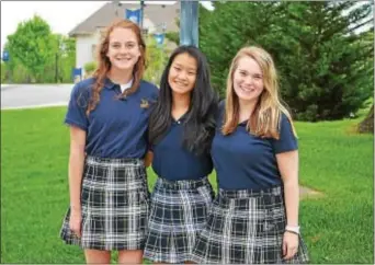  ??  ?? Salutatori­an Katie Goldschmid­t. O’Connor, Valedictor­ian Merry Gu, and Mistress of Ceremonies Julia